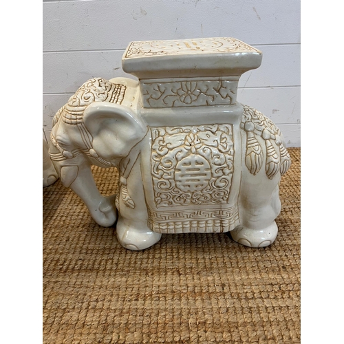 381 - A pair of white ceramic elephant themed plant stands. H 40cm