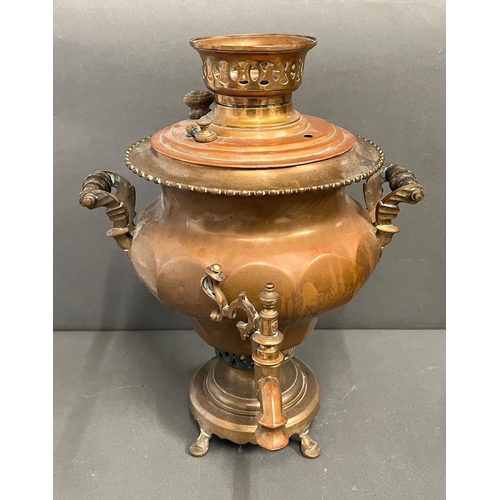 399 - A copper samovar urn and Arabic early brass coffee pot