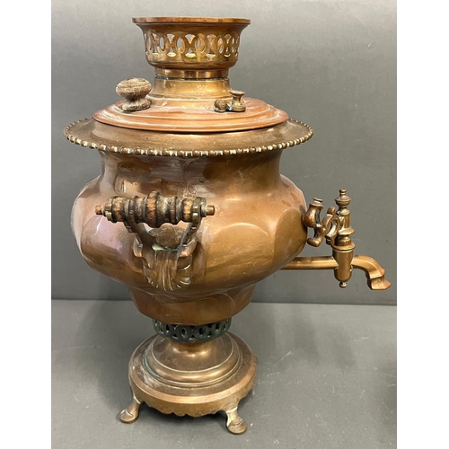 399 - A copper samovar urn and Arabic early brass coffee pot