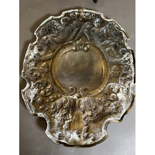 402 - A pair of brass wall sconce, cast backplate with winged cherubs and twin arm candle holders