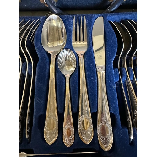 418 - A twelve place setting canteen of cutlery by SBS in a blue leather case.