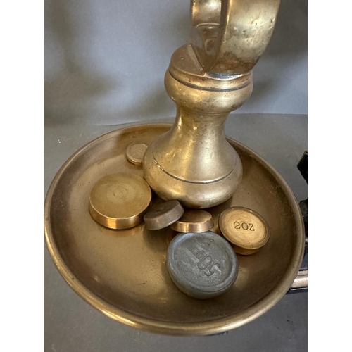 424 - A set of vintage black cast iron and brass scales along with weights