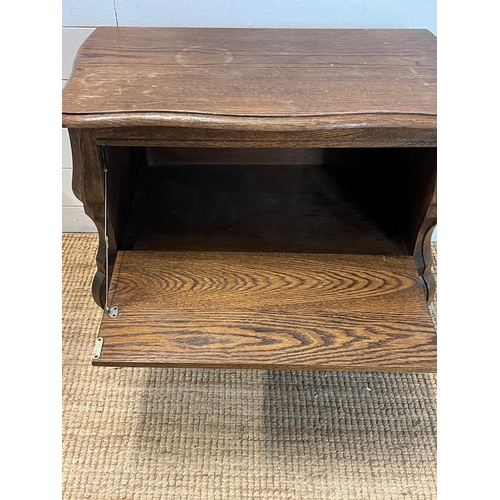 43 - A wooden side cabinet with faux drawers opening to a cupboard (H65cm W74cm D40cm)