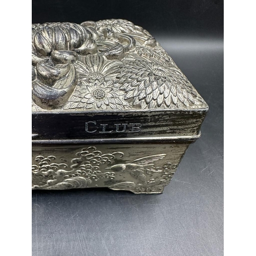 439 - A hammered white metal cigarette box with floral motif, inscribed 