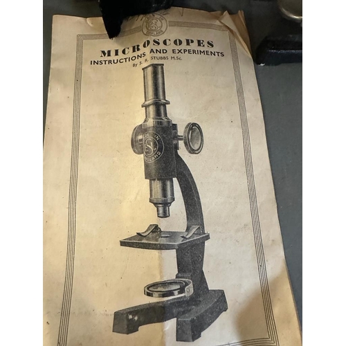 449 - A vintage boxed SEL microscope with glass slides