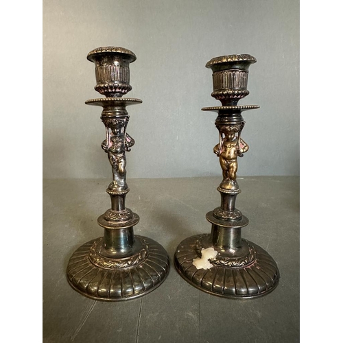 453 - A selection of mixed metal items, a serving dish, two candlesticks and a pewter tea pot