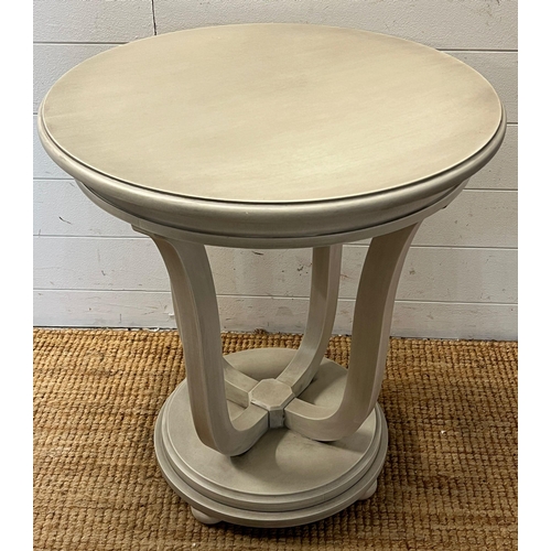 52 - A side table with four supporting legs on circular base by Wychwood Design (H66cm Dia60cm)