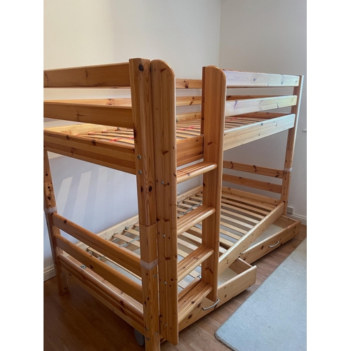 60 - A set of pine bunk beds by Flexa along with a hanging shelf and book holder