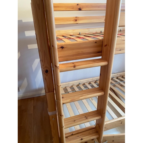 60 - A set of pine bunk beds by Flexa along with a hanging shelf and book holder