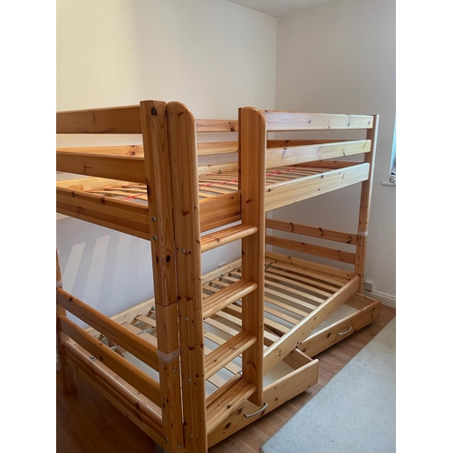 60 - A set of pine bunk beds by Flexa along with a hanging shelf and book holder