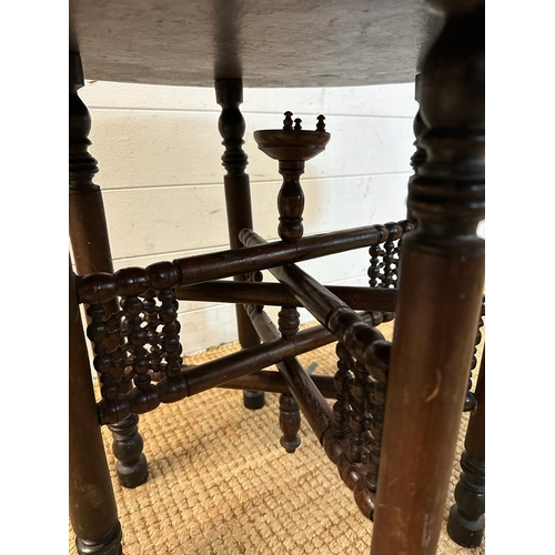 62 - A foldable brass topped Indian tea table