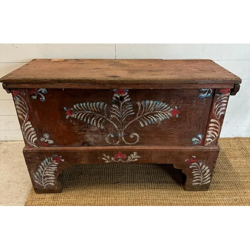 63 - An oak painted trunk with a scrolling fern motif. Height 69 106x45