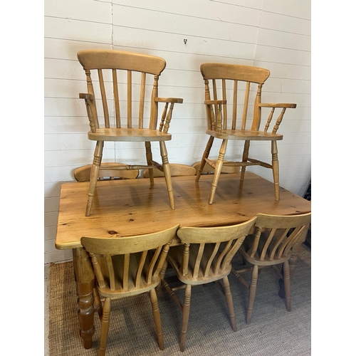 65 - A pine farmhouse table with eight chairs (H77cm W168cm D83cm)