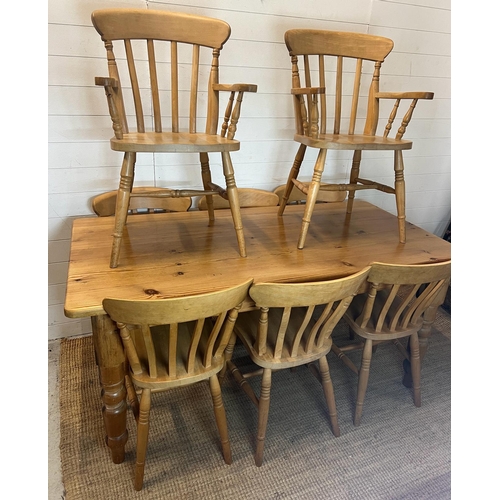 65 - A pine farmhouse table with eight chairs (H77cm W168cm D83cm)