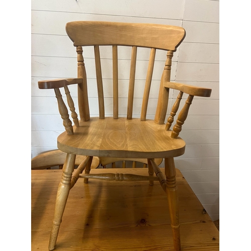 65 - A pine farmhouse table with eight chairs (H77cm W168cm D83cm)