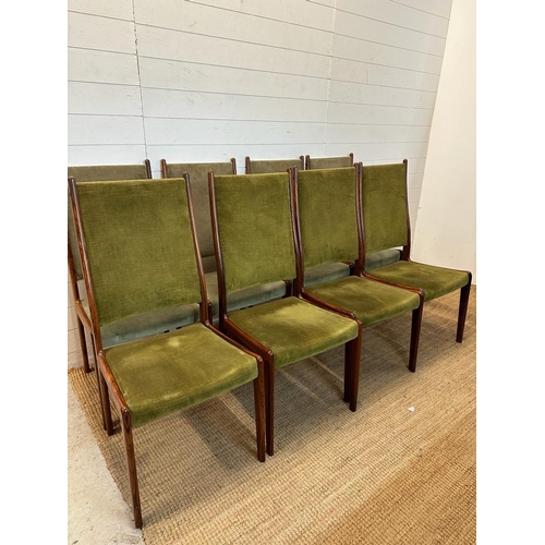 66 - Eight Danish mid-century dining chairs by Johannes Anderson upholstered in green