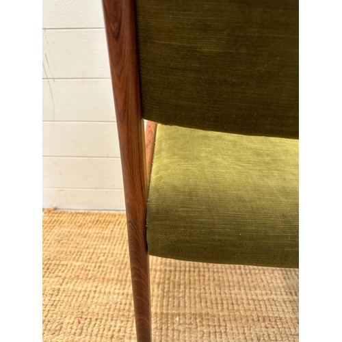 66 - Eight Danish mid-century dining chairs by Johannes Anderson upholstered in green