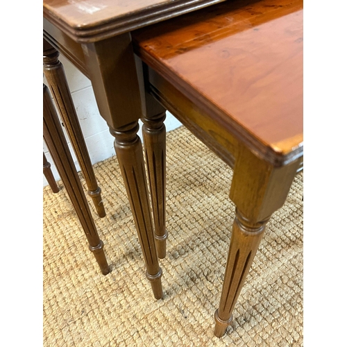 67 - A nest of three table on fluted legs (H54cm W56cm D38cm)