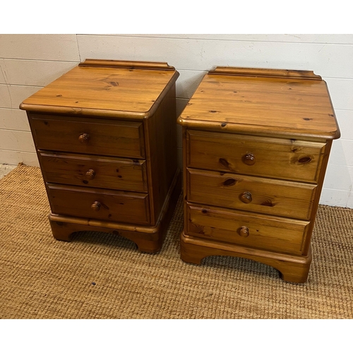 69 - A pair of Ducal bedsides with three drawers (H64cm W46cm D44cm)