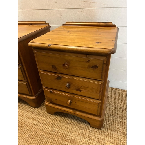 69 - A pair of Ducal bedsides with three drawers (H64cm W46cm D44cm)