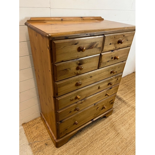 73 - A Ducal chest of drawers, four over four (H117cm W88cm D45cm)