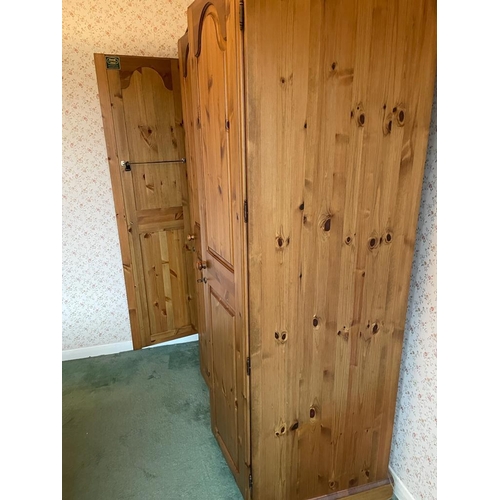 77 - A triple pine Ducal wardrobe