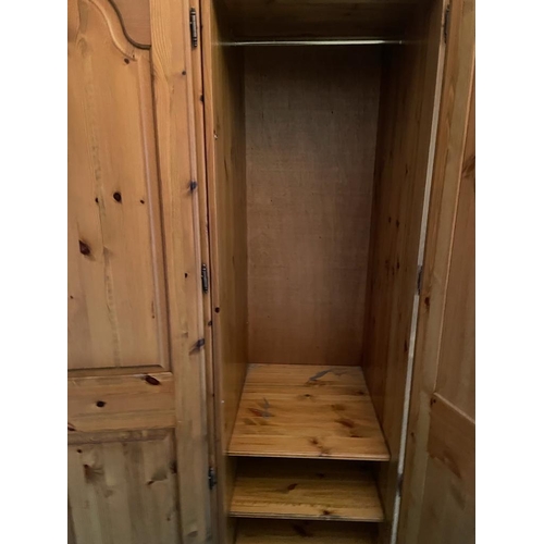 77 - A triple pine Ducal wardrobe