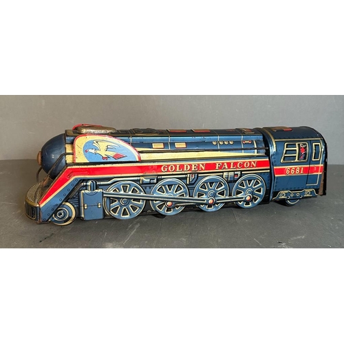 778 - A vintage tin golden Falcon toy train