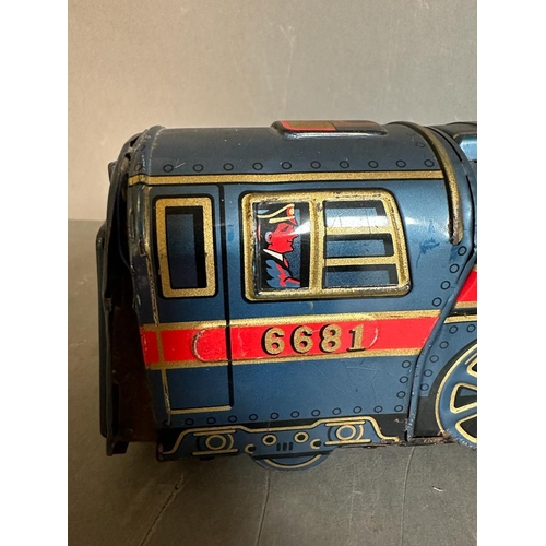 778 - A vintage tin golden Falcon toy train