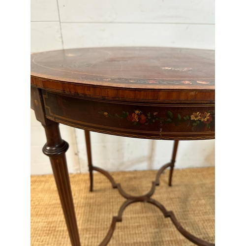 91 - An Edwardian mahogany and painted centre table. Height 75 diameter 69