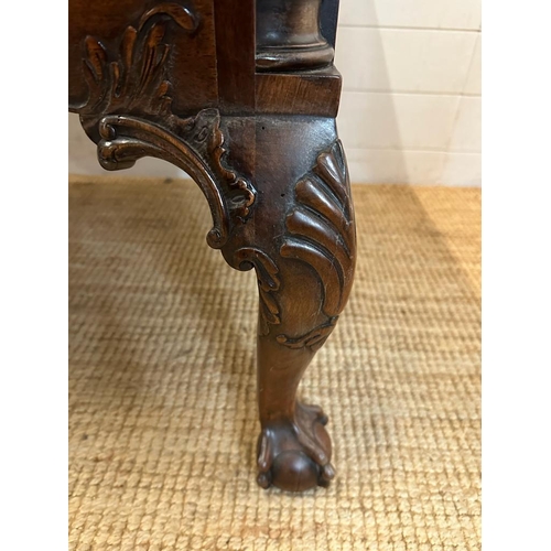 94 - a Georgian style walnut knee hole desk with brass drop handles and galleried top on claw and ball fe... 