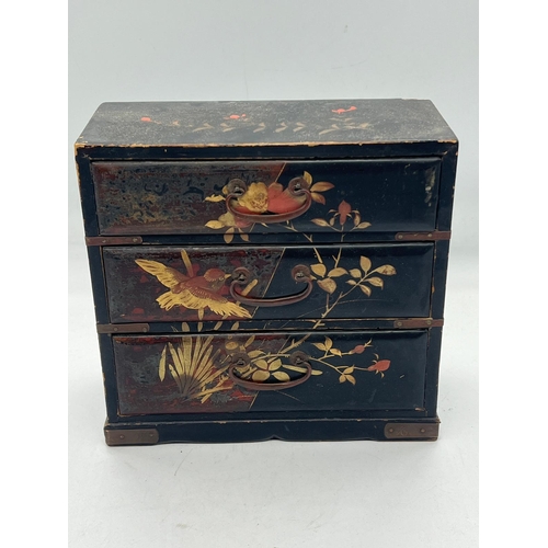 97 - A small black lacquer wood table top chest of drawers (H17cm W17cm D8cm)