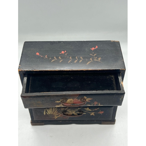 97 - A small black lacquer wood table top chest of drawers (H17cm W17cm D8cm)