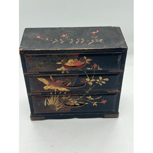 97 - A small black lacquer wood table top chest of drawers (H17cm W17cm D8cm)