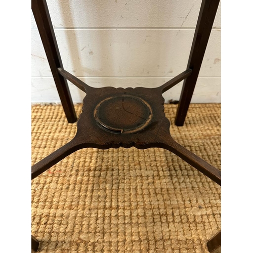 110 - An Edwardian mahogany bedside cabinet with stretcher base (H77cm W33cm D33cm