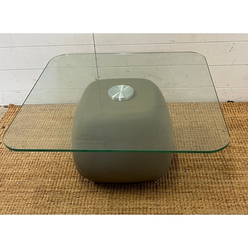 120 - A glass side table with faux stone style base (H36cm Sw70cm)