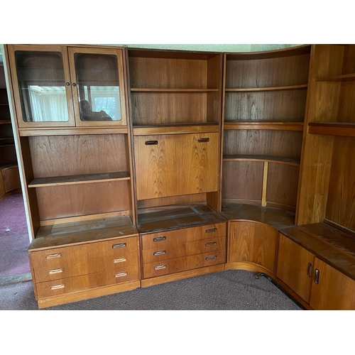 123 - A Mid Century wall unit made by G-Plan comprising of four units, one glazed display unit, one drinks... 