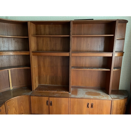 123 - A Mid Century wall unit made by G-Plan comprising of four units, one glazed display unit, one drinks... 