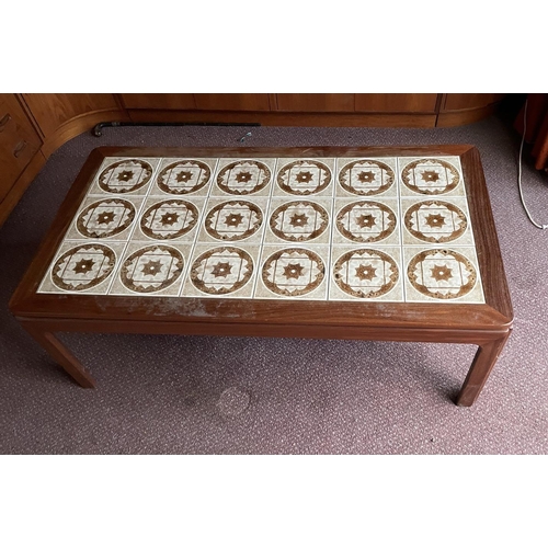 124 - A Mid Century coffee table with tiled top (H46cm W134cm D74cm)