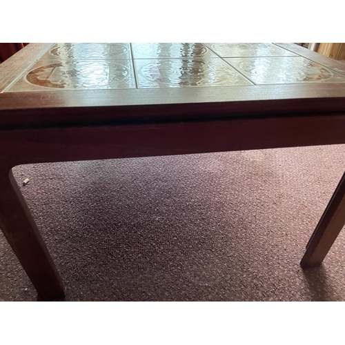 124 - A Mid Century coffee table with tiled top (H46cm W134cm D74cm)