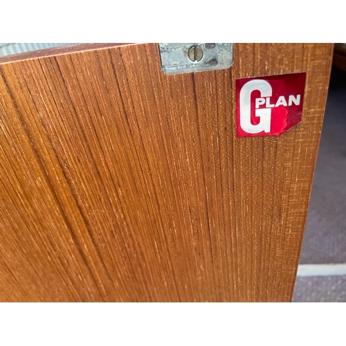 125 - A G-Plan Mid Century sideboard comprising of four drawers to centre flanked by two cupboards either ... 