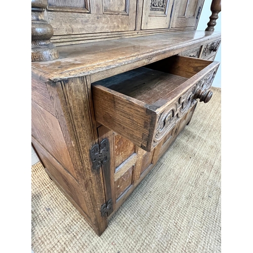 13 - A light oak buffet court cupboard, three panelled doors top and bottom (H139cm W140cm D54cm)