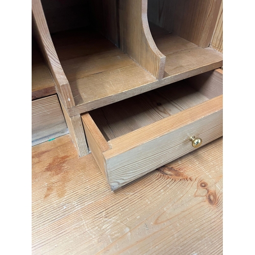 145 - A pine bureau with brass handles and drop down writing slope (H105cm W93cm D47cm)