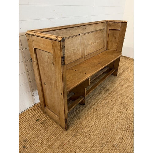 148 - A pine pew with shelf behind (H92cm W143cm D48cm SH48cm)