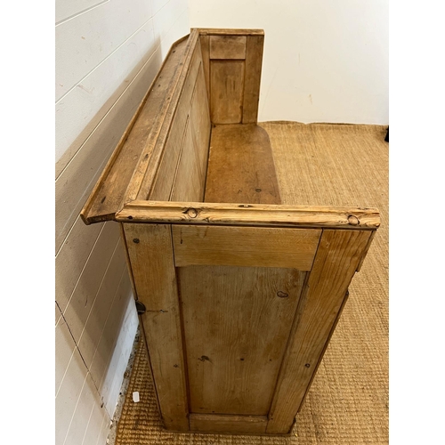 148 - A pine pew with shelf behind (H92cm W143cm D48cm SH48cm)