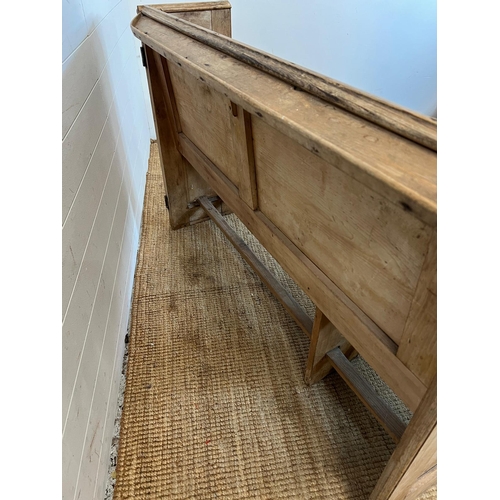 148 - A pine pew with shelf behind (H92cm W143cm D48cm SH48cm)