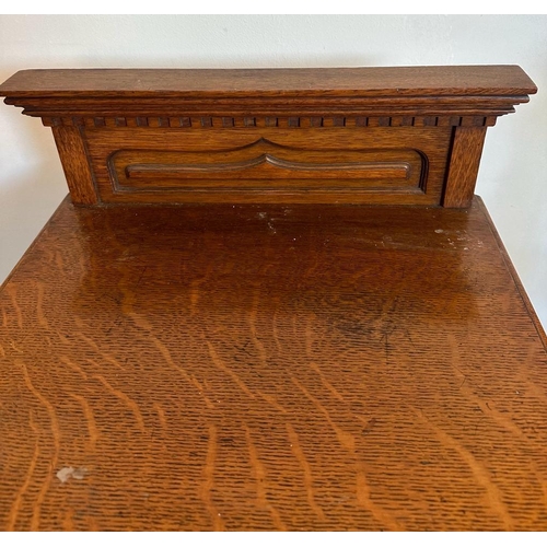 165A - A vintage oak coal box with carved front tree detail and galleried top (H83cm W44cm D41cm)