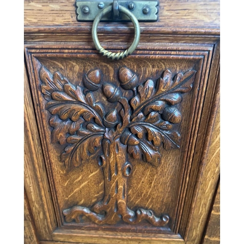 165A - A vintage oak coal box with carved front tree detail and galleried top (H83cm W44cm D41cm)