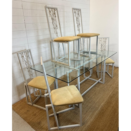 170 - A large glass and metal framed table with six high back chairs (H74cm W180cm D90cm)