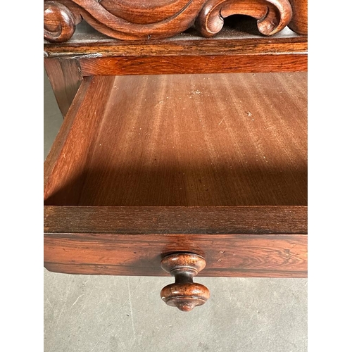 172 - A Victorian carved rosewood Canterbury on turned feet with single drawer under. (53cm x 37cm x 42cm)